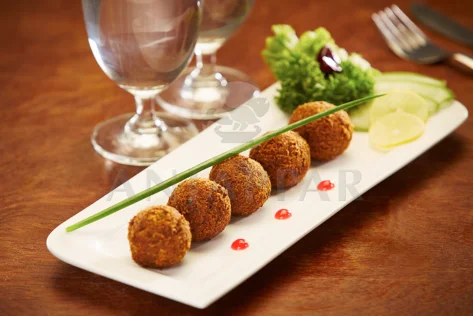 A plate of food with meatballs and vegetables, a delicious and nutritious for perfect meal