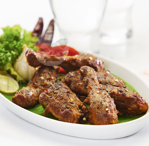Mutton Seekh Kebab prepared with minced mutton, onions and a blend of spices served in a plate.