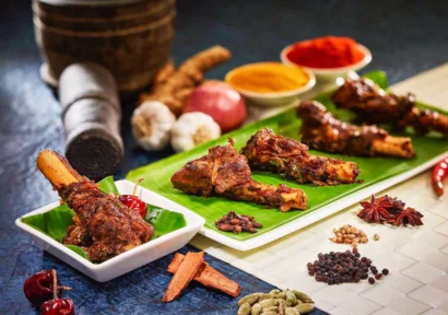 A seasoned Meat served on a platter with aromatic spices,garlic,turmeric & colourful spice powders